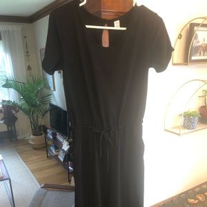 Fun black jumpsuit with tie waist and pockets!